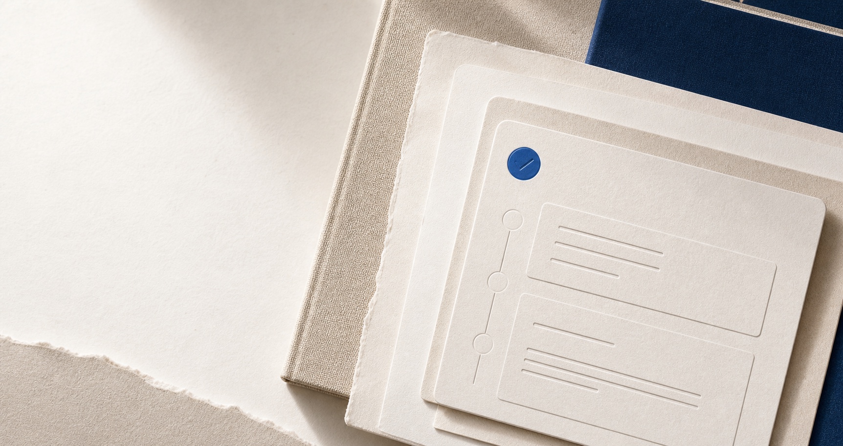 Layered application papers, book cloth and portfolio covers in warm natural materials